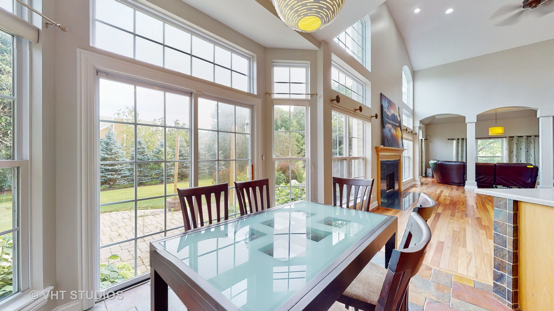 305 Saddle Lane Fox River Grove, IL 60021 - Photo 19 of 55 a view of a dining room with furniture a chandelier and a large window