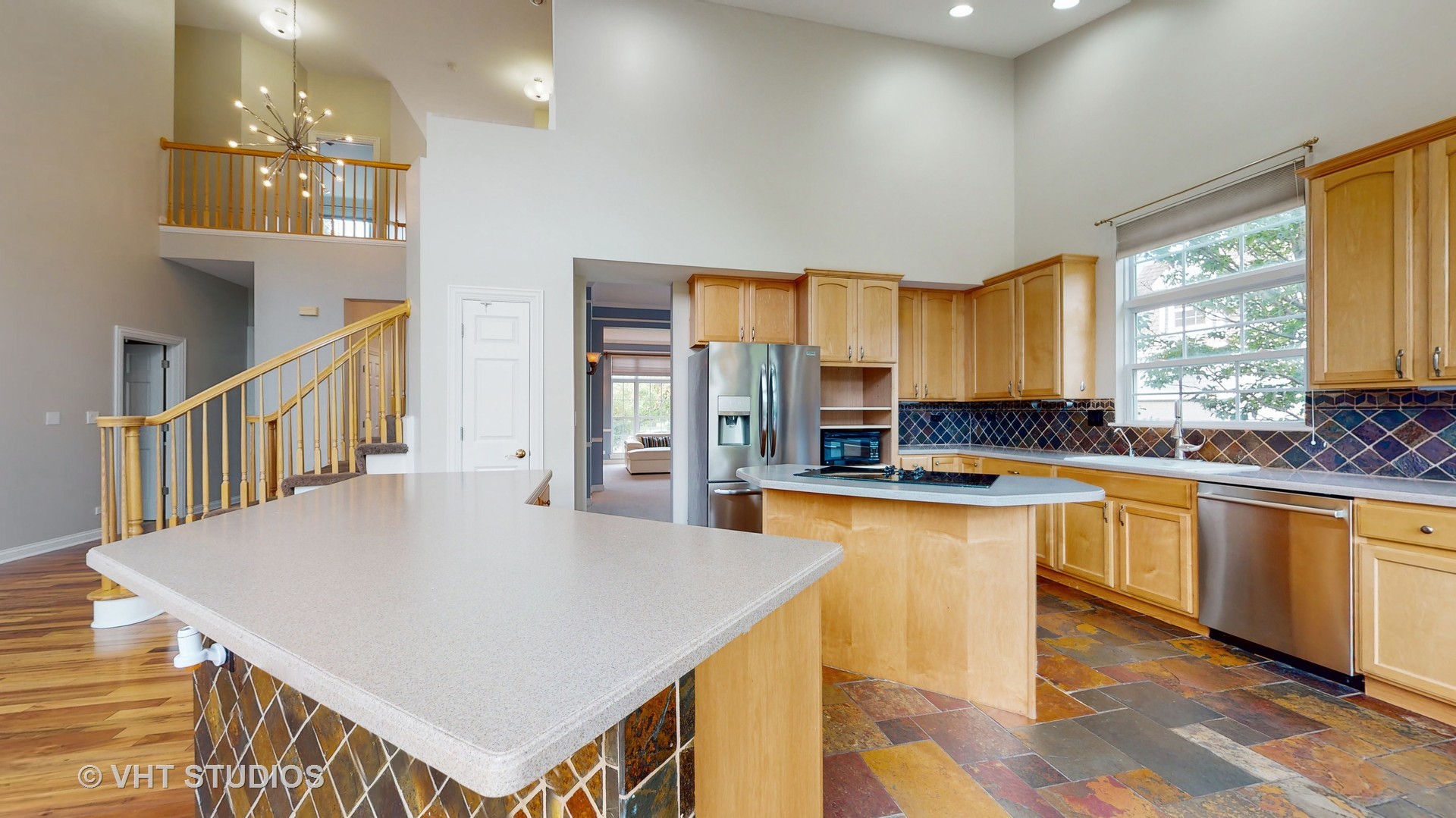 305 Saddle Lane Fox River Grove, IL 60021 - Photo 22 of 55 a kitchen with stainless steel appliances microwave stove refrigerator sink and cabinets