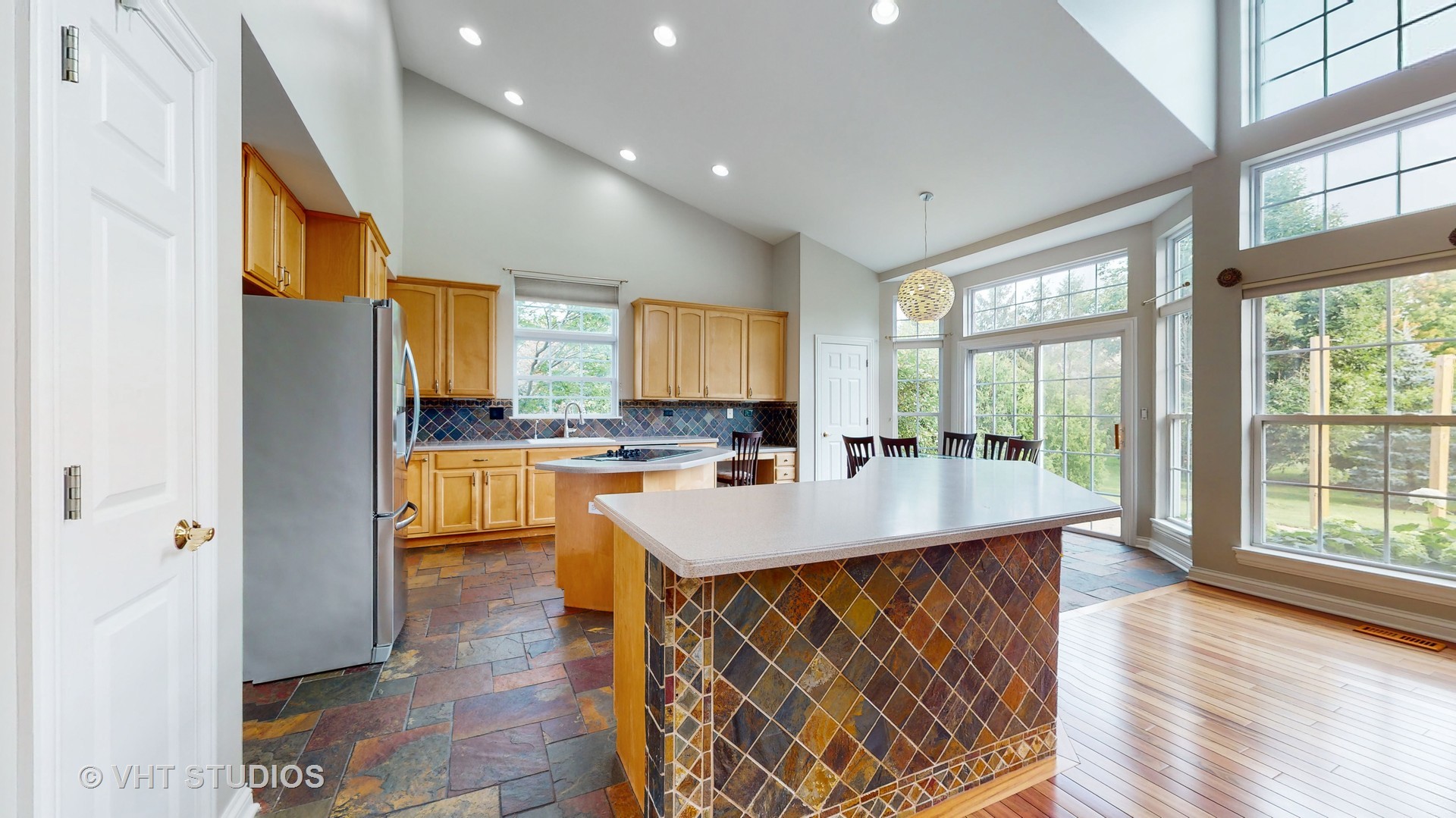 305 Saddle Lane Fox River Grove, IL 60021 - Photo 23 of 55 a kitchen with a sink a counter top space and living room view