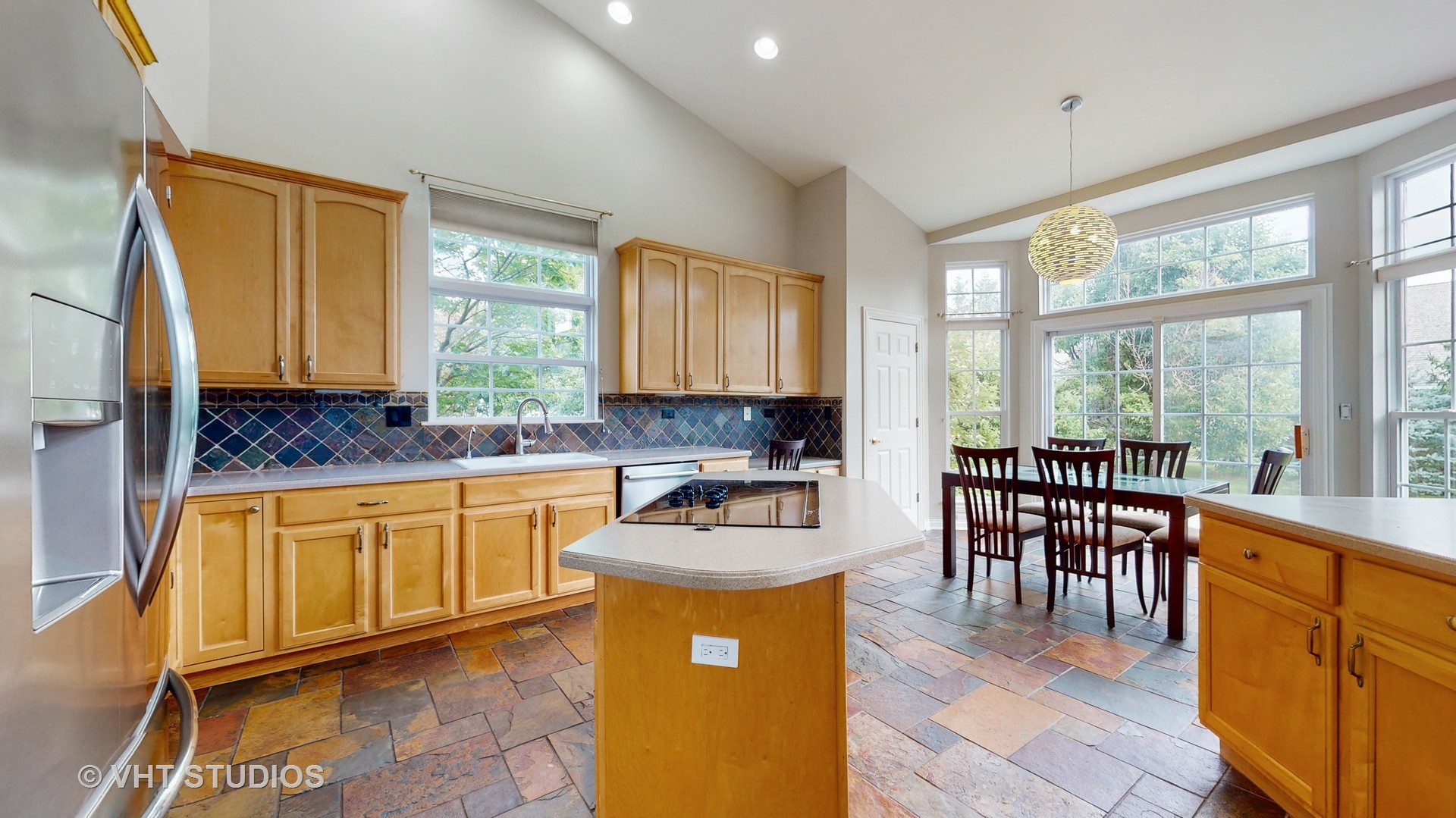 305 Saddle Lane Fox River Grove, IL 60021 - Photo 24 of 55 a kitchen with stainless steel appliances granite countertop sink stove top oven and cabinets