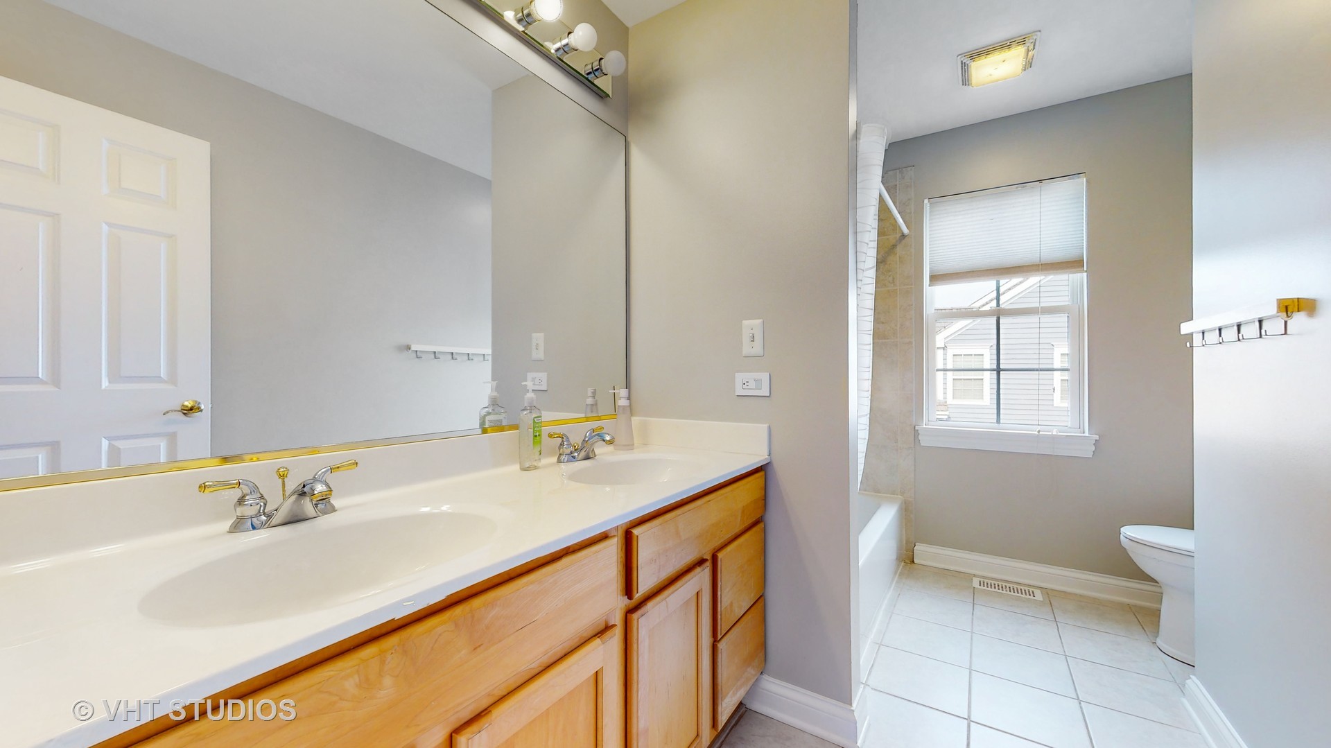 305 Saddle Lane Fox River Grove, IL 60021 - Photo 39 of 55 a bathroom with a sink and a toilet