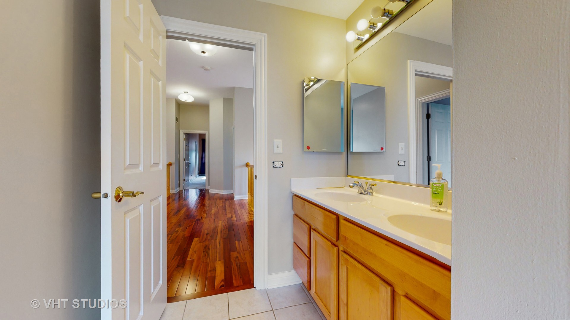 305 Saddle Lane Fox River Grove, IL 60021 - Photo 41 of 55 a bathroom with a sink and a mirror