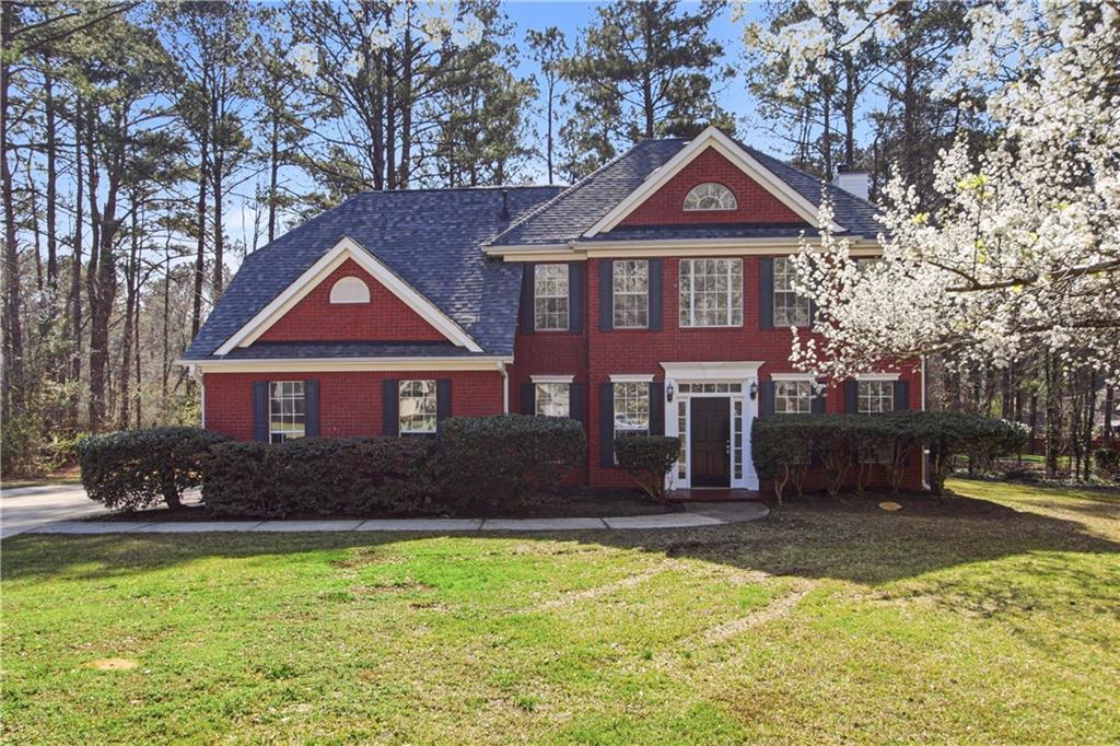 2296 Talbot Ridge Jonesboro, GA 30236 - Photo 1 of 44 a front view of a house with a yard