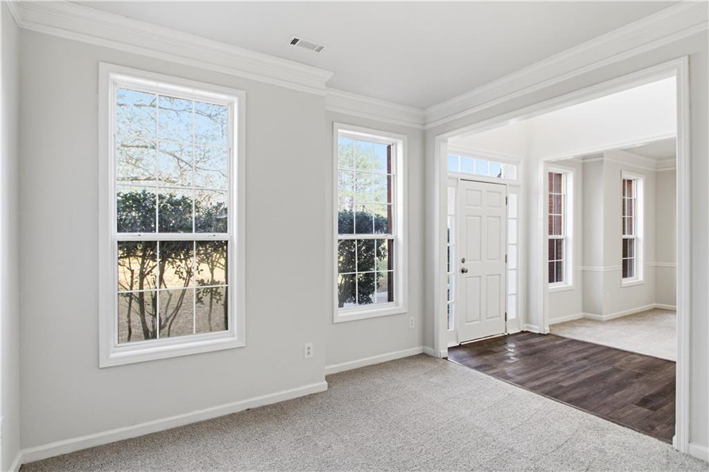 2296 Talbot Ridge Jonesboro, GA 30236 - Photo 11 of 44 a view of an empty room with window and wooden floor
