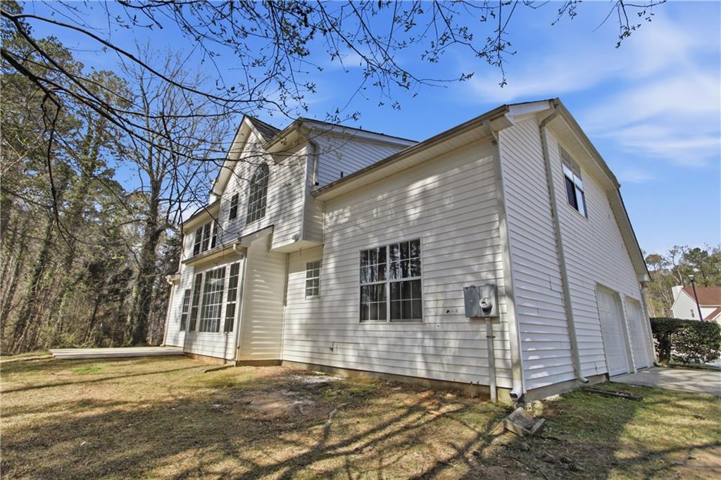 2296 Talbot Ridge Jonesboro, GA 30236 - Photo 41 of 44 a view of a house with a yard