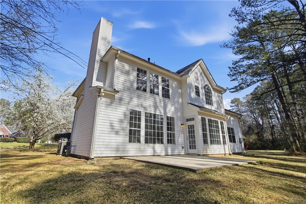 2296 Talbot Ridge Jonesboro, GA 30236 - Photo 5 of 44 a front view of a house with a yard
