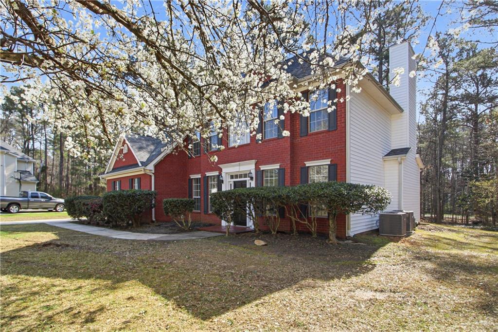 2296 Talbot Ridge Jonesboro, GA 30236 - Photo 8 of 44 a view of a house with a yard