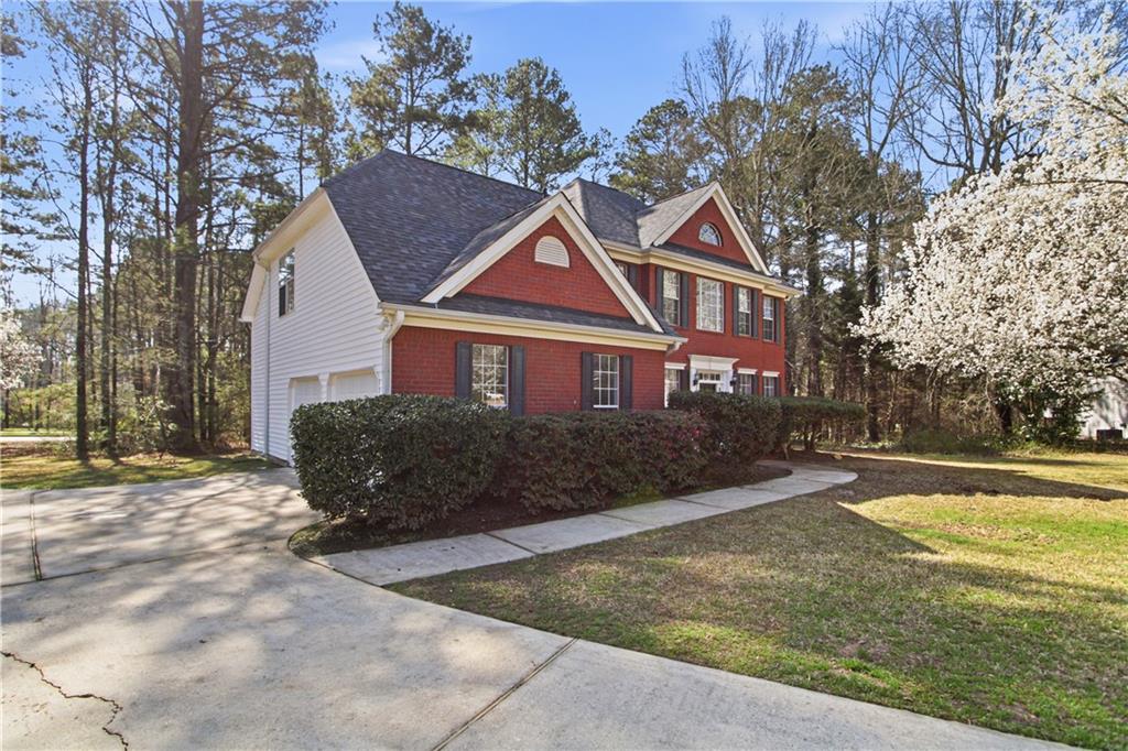 2296 Talbot Ridge Jonesboro, GA 30236 - Photo 9 of 44 a front view of a house with a yard and garage