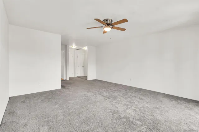 a view of a big room with carpet