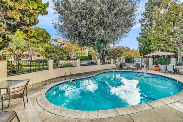 a view of swimming pool with seating space