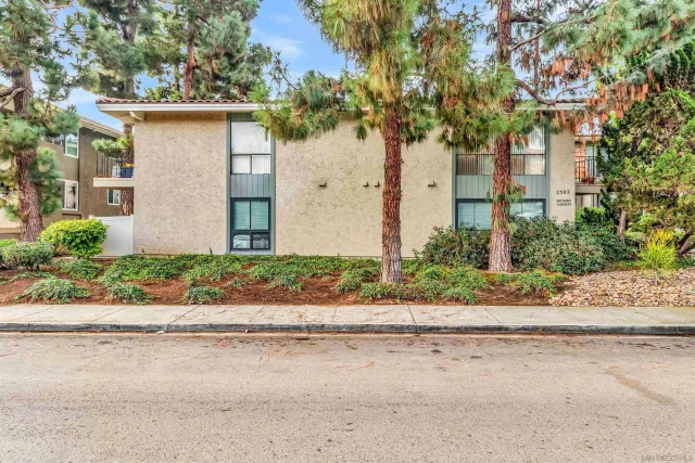 front view of a house with a small yard