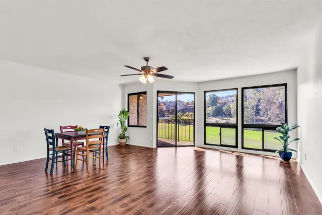 a view of a livingroom with furniture window and wooden floor