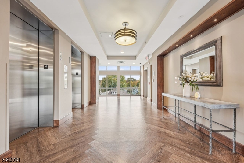 41 West Prospect Street Waldwick, NJ 07463 - Photo 16 of 19 a view of a hallway with wooden floor and a large window