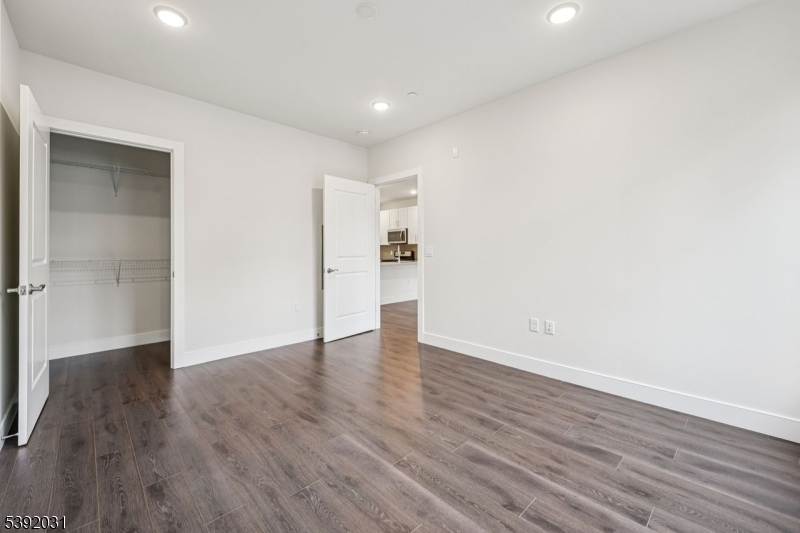 41 West Prospect Street Waldwick, NJ 07463 - Photo 7 of 19 a view of an empty room with wooden floor and a window