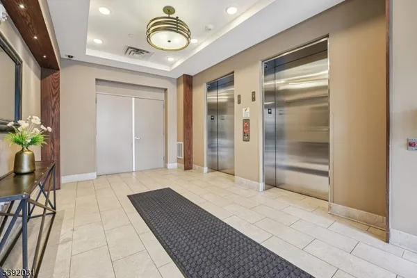 a view of a hallway with a chandelier