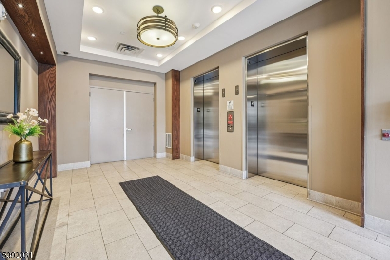 41 West Prospect Street Waldwick, NJ 07463 - Photo 10 of 19 a view of a hallway with a chandelier