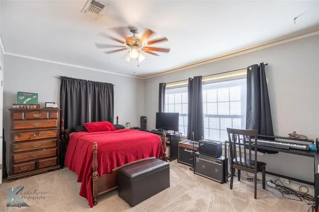 a bed room with a bed and a window