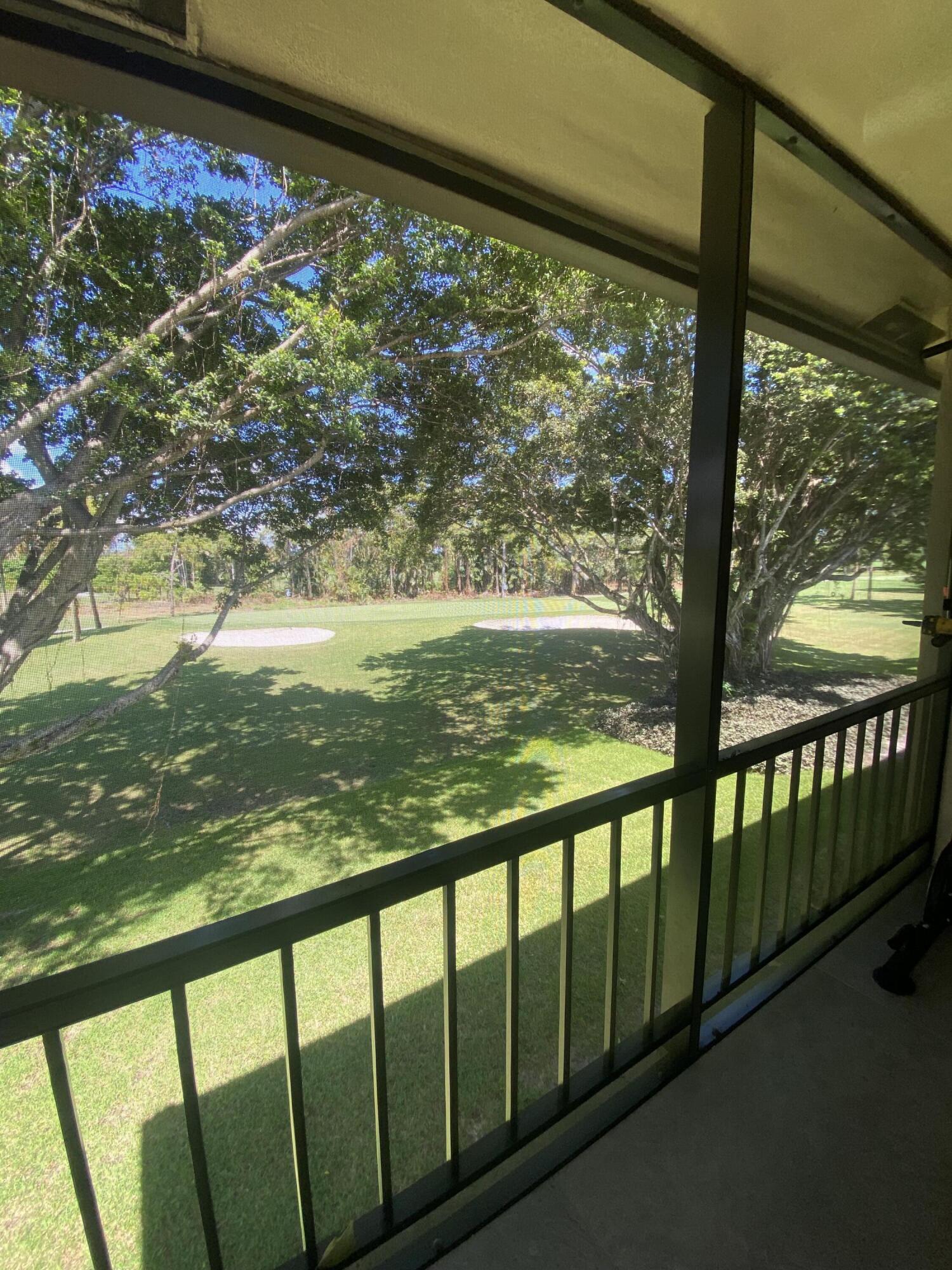 21506 Juego Circle, Unit 28H Boca Raton, FL 33433 - Photo 14 of 21 a view of a large window with an outdoor space