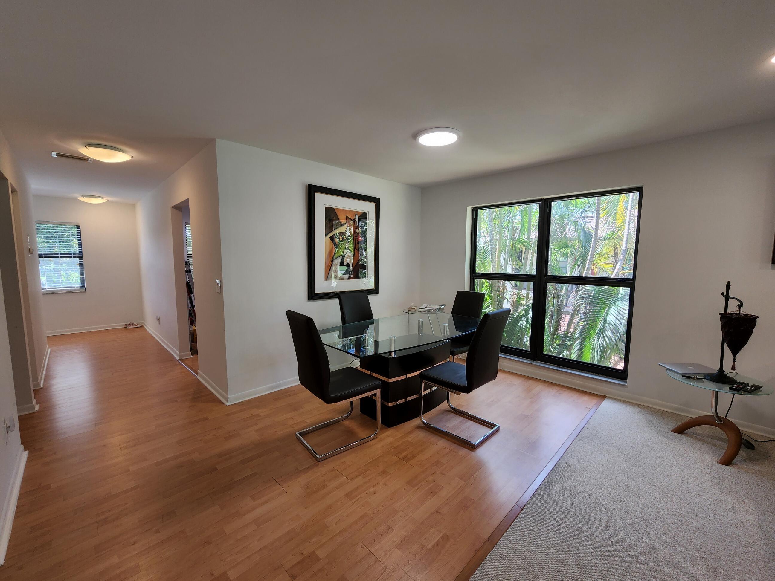 21506 Juego Circle, Unit 28H Boca Raton, FL 33433 - Photo 9 of 21 a living room with furniture and a window