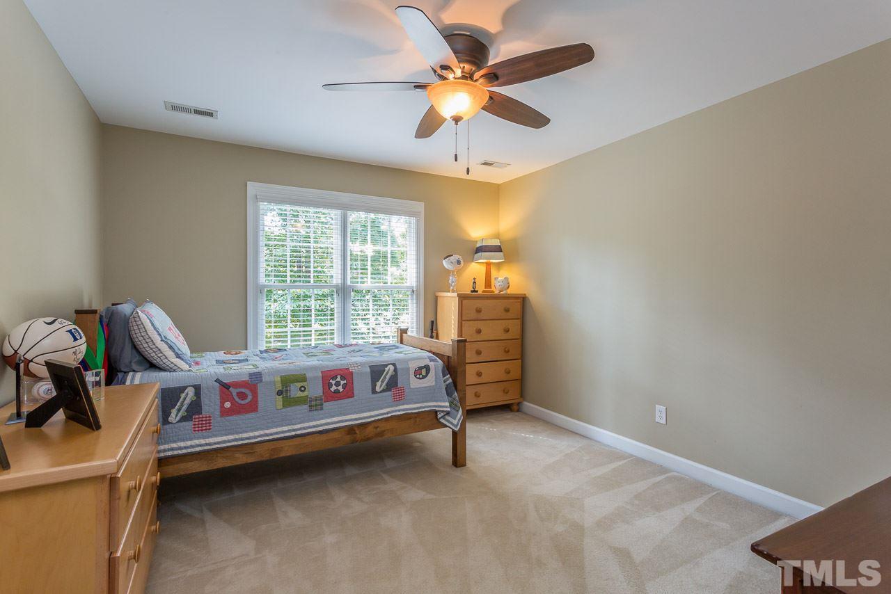 5004 Big Creek Road Raleigh, NC 27613 - Photo 17 of 25 This bedroom is located on the front center of the home.
