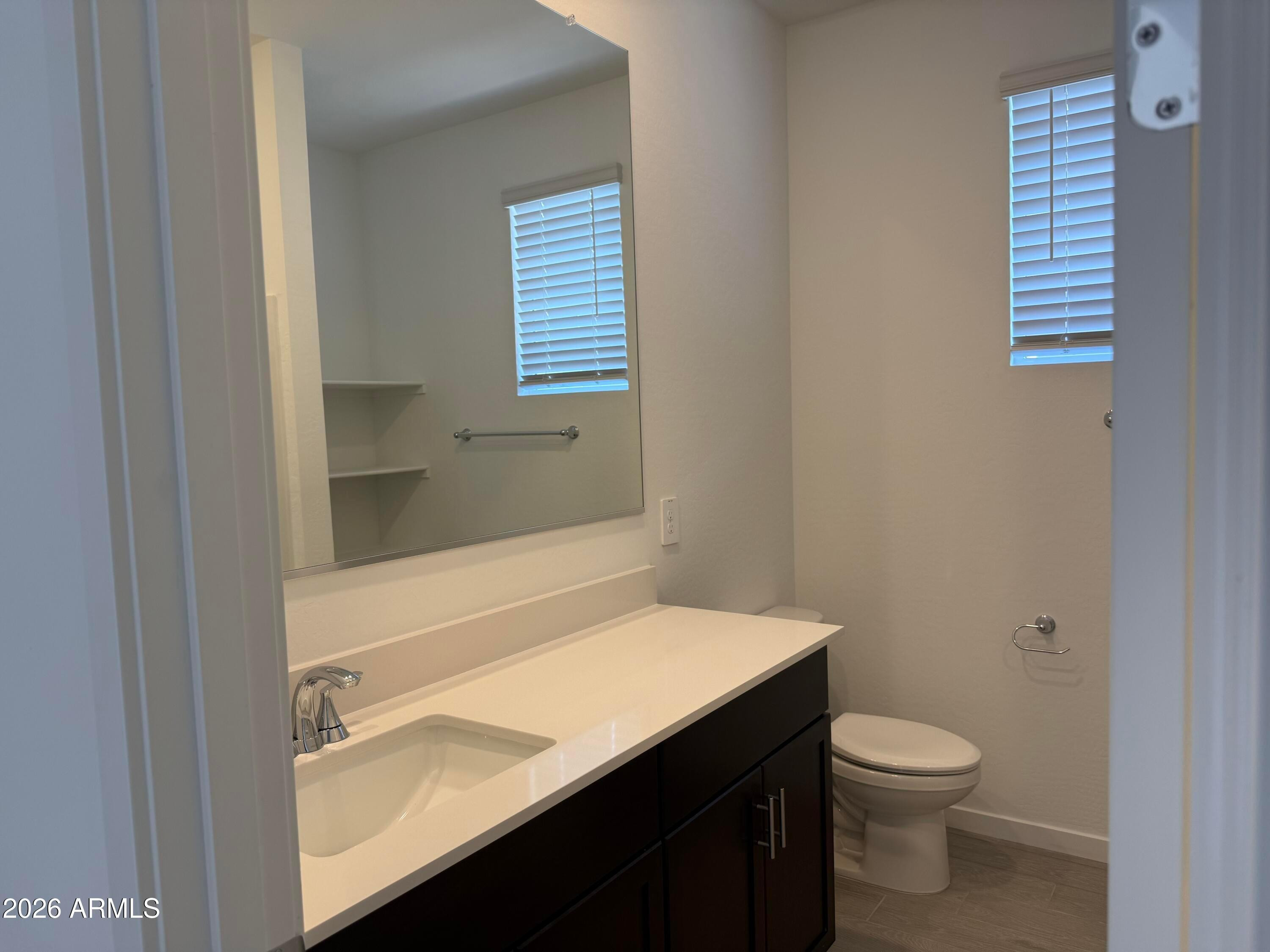 2478 Grenache Road San Tan Valley, AZ 85143 - Photo 15 of 34 a bathroom with a sink a toilet and shower