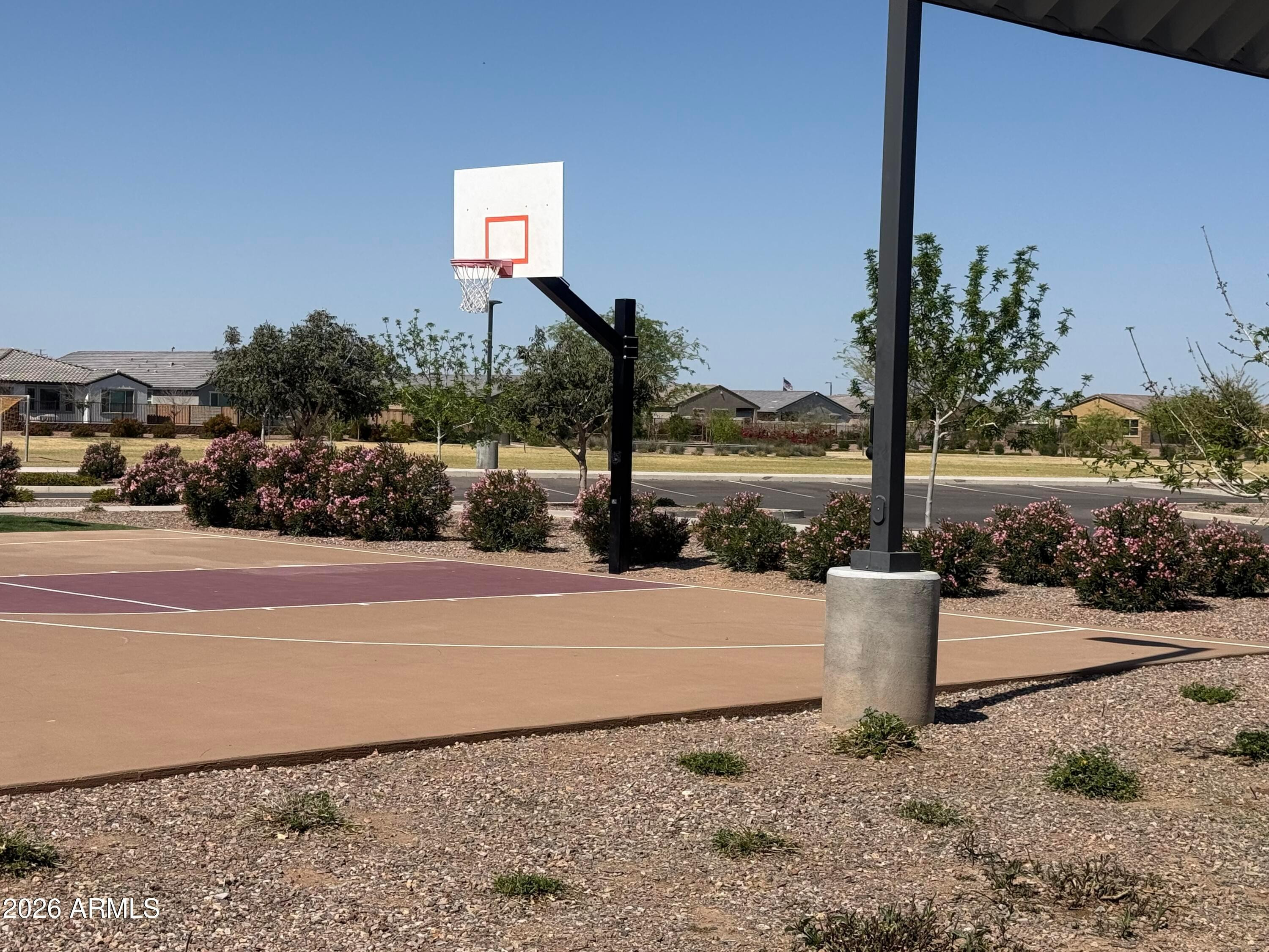 2478 Grenache Road San Tan Valley, AZ 85143 - Photo 32 of 34 a view of a street with a building in the background