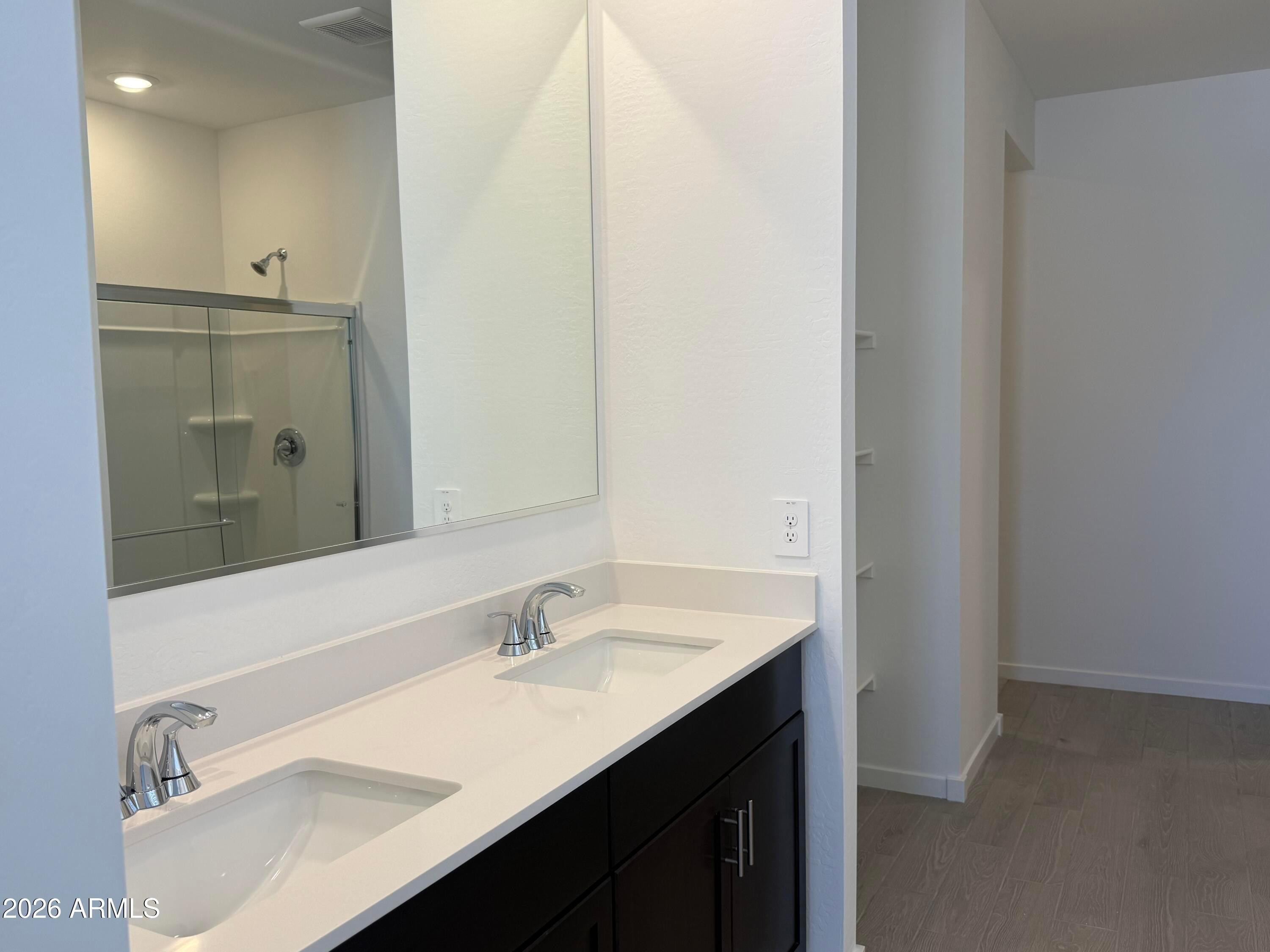 2478 Grenache Road San Tan Valley, AZ 85143 - Photo 10 of 34 a bathroom with a sink vanity and a mirror