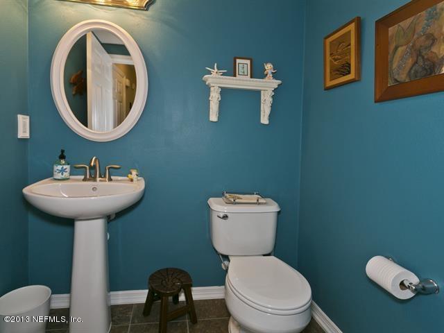 216 Michelangelo Place St. Augustine, FL 32084 - Photo 13 of 18 a bathroom with a toilet sink and mirror
