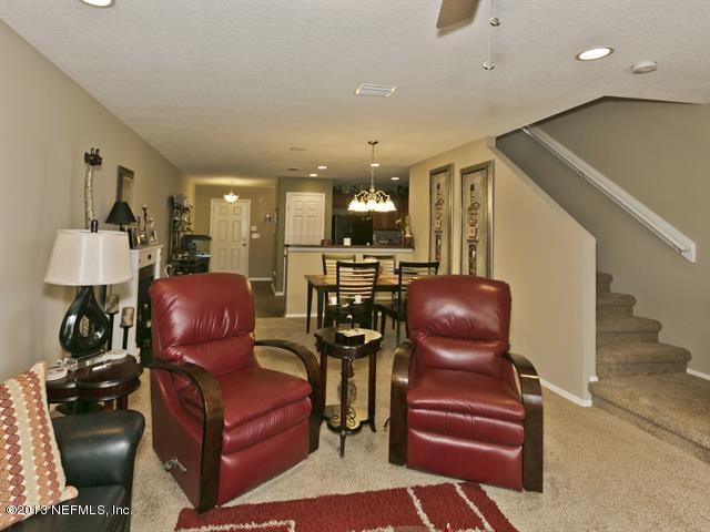 216 Michelangelo Place St. Augustine, FL 32084 - Photo 7 of 18 a living room with furniture and wooden floor