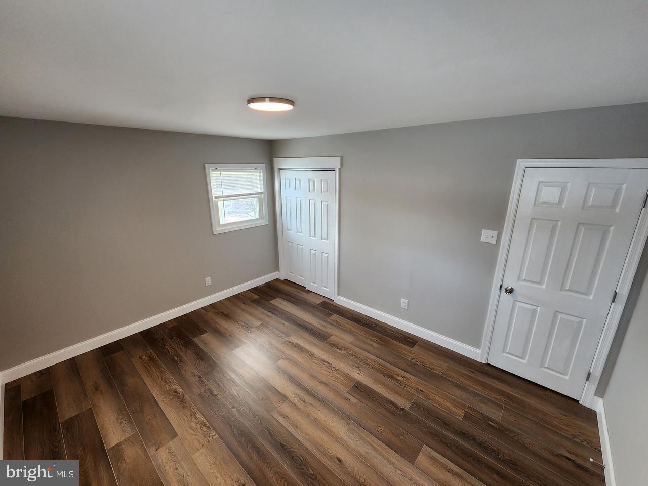 9 Bancroft Road Marlton, NJ 08053 - Photo 18 of 27 a view of empty room with wooden floor and fan
