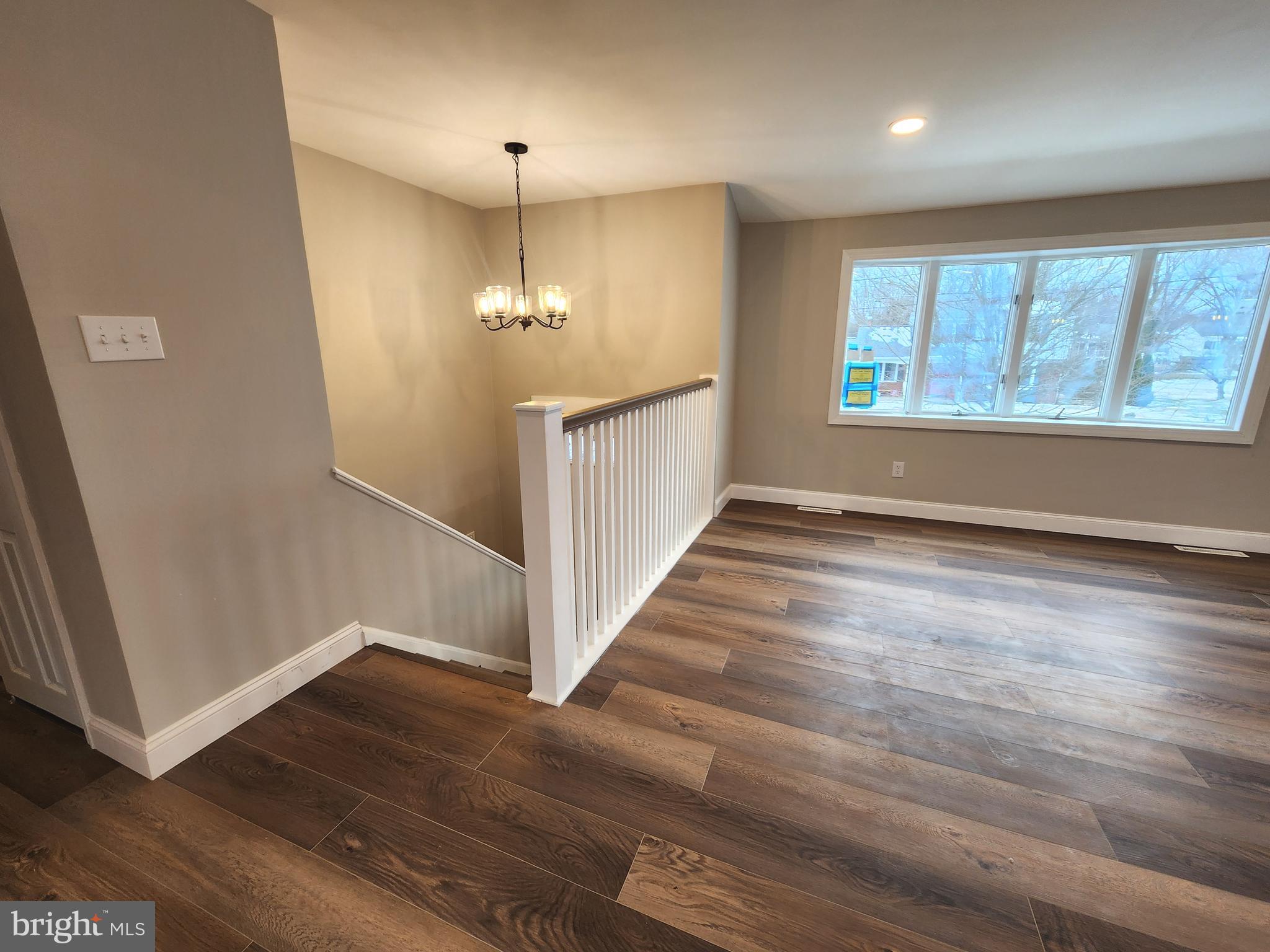 9 Bancroft Road Marlton, NJ 08053 - Photo 3 of 27 an empty room with wooden floor and windows