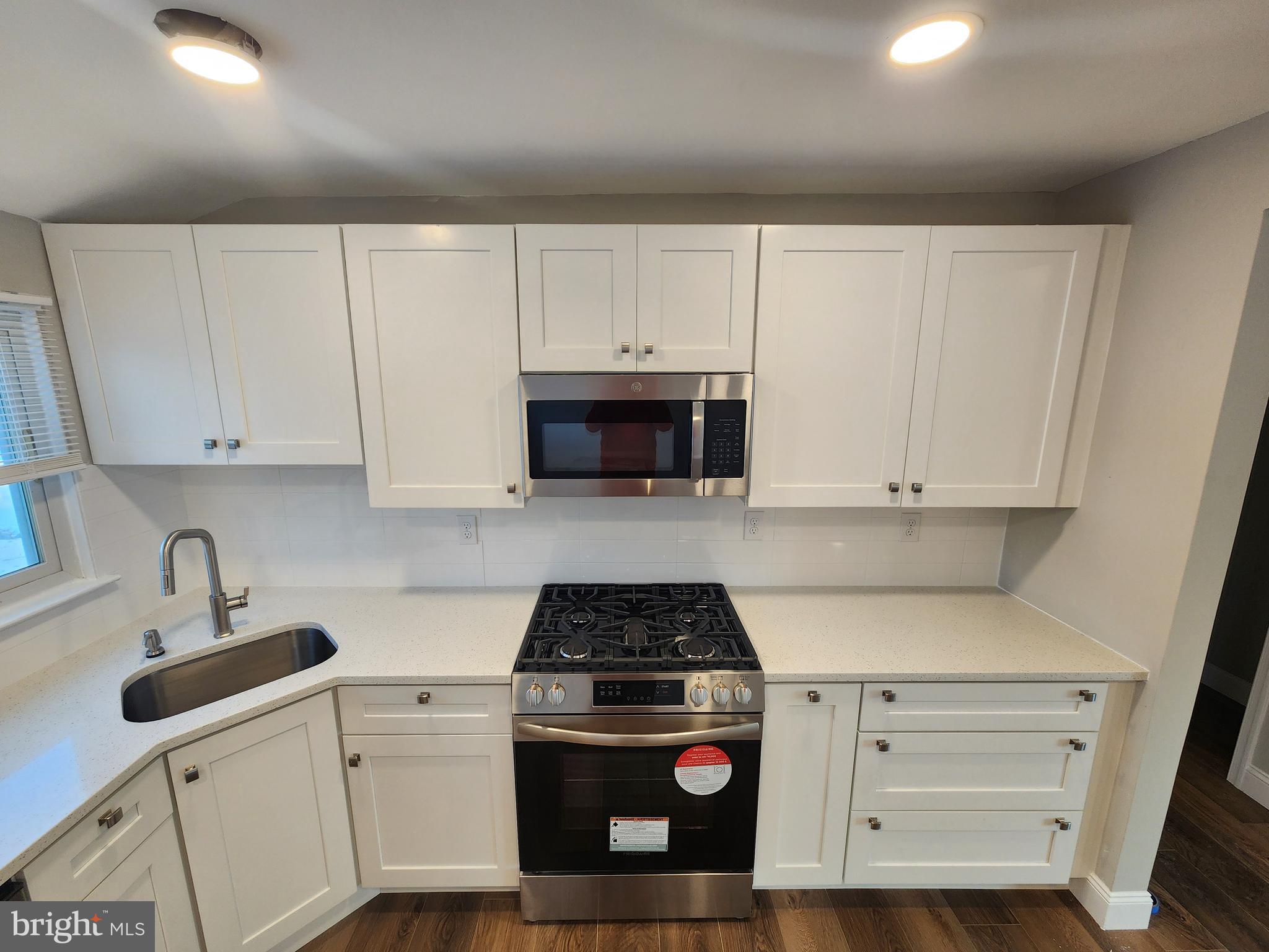 9 Bancroft Road Marlton, NJ 08053 - Photo 6 of 27 a kitchen with white cabinets and white appliances