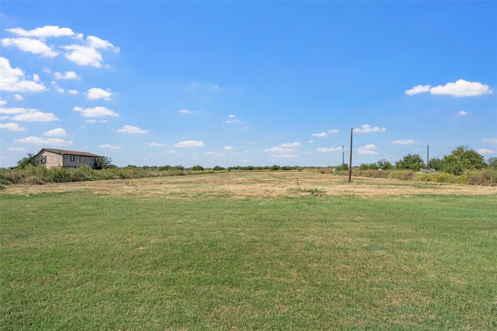 3449 Bluhm Road West, TX 76691 - Photo 33 of 40 View of green lawn with a view of rural / pastoral area
