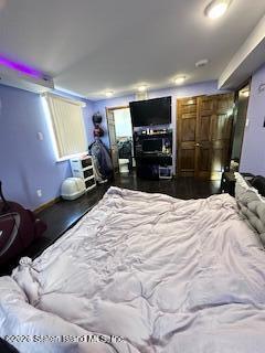 26 Windham Loop, Unit 3A Staten Island, NY 10314 - Photo 15 of 19 a bed room with a bed window and a television