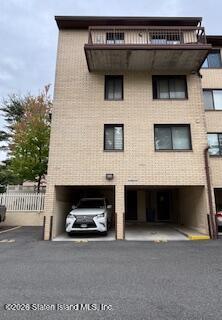 26 Windham Loop, Unit 3A Staten Island, NY 10314 - Photo 2 of 19 a front view of a house with a garage