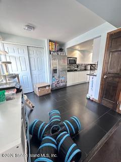 26 Windham Loop, Unit 3A Staten Island, NY 10314 - Photo 5 of 19 a view of a living room with kitchen and furniture