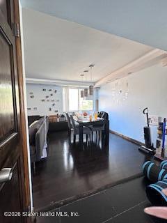 26 Windham Loop, Unit 3A Staten Island, NY 10314 - Photo 6 of 19 a view of a livingroom with furniture and a dinning table