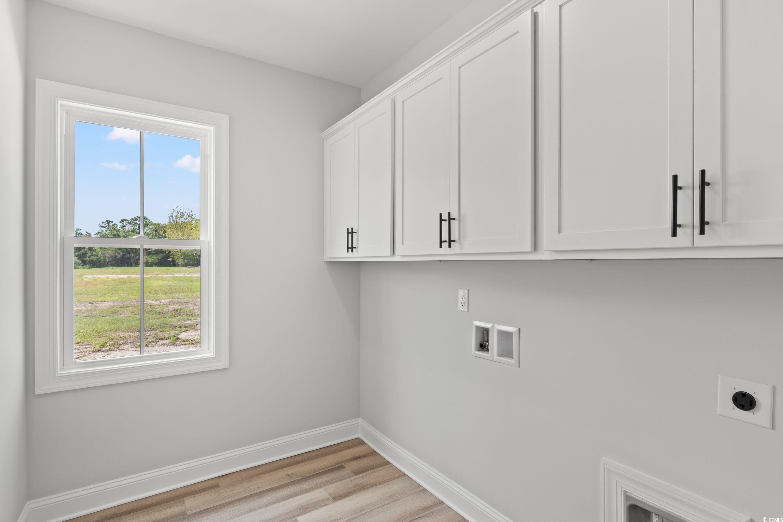 1509 Crooked Hook Road North Myrtle Beach, SC 29582 - Photo 9 of 40 Clothes washing area featuring a healthy amount of