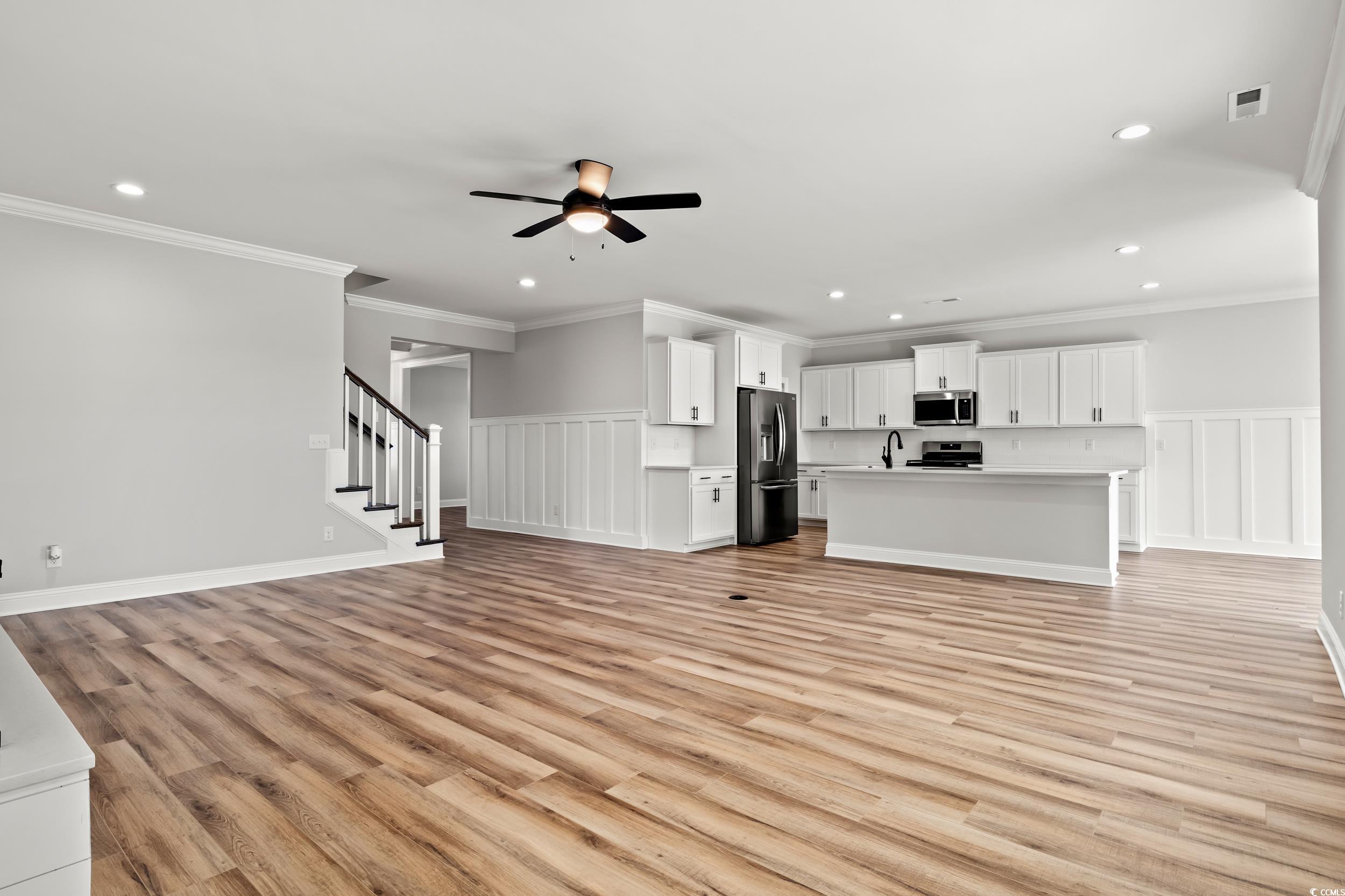 1509 Crooked Hook Road North Myrtle Beach, SC 29582 - Photo 10 of 40 Unfurnished living room with light wood-type floor