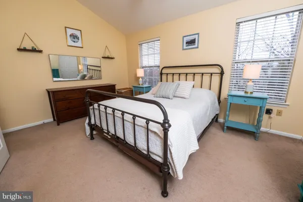 a bedroom with a bed and a table