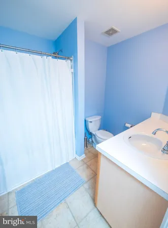 a en suite bathroom with a sink and a toilet