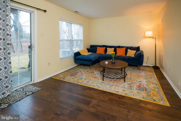 a living room with furniture and a rug