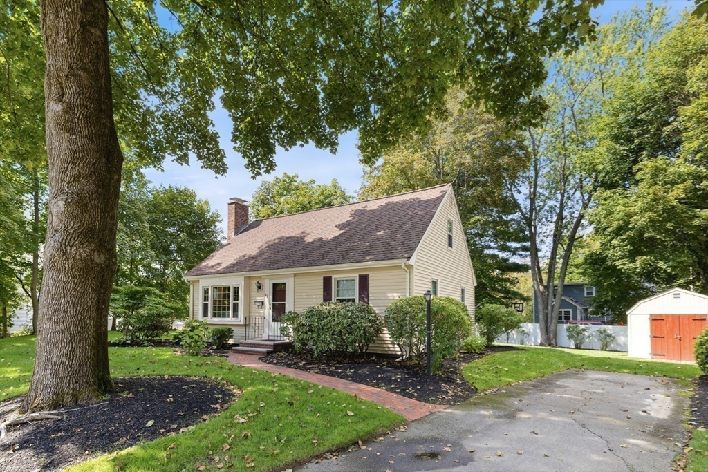 42 Sturges Road Reading, MA 01867 - Photo 1 of 42 a front view of a house with garden