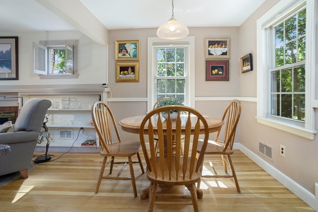 42 Sturges Road Reading, MA 01867 - Photo 16 of 42 a view of a dining room with furniture a chandelier and wooden floor