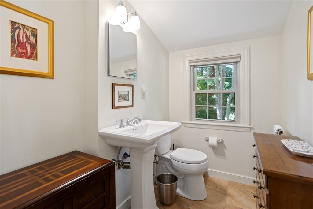42 Sturges Road Reading, MA 01867 - Photo 24 of 42 a bathroom with a toilet a sink and mirror