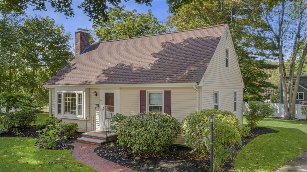 42 Sturges Road Reading, MA 01867 - Photo 3 of 42 front view of house with a yard