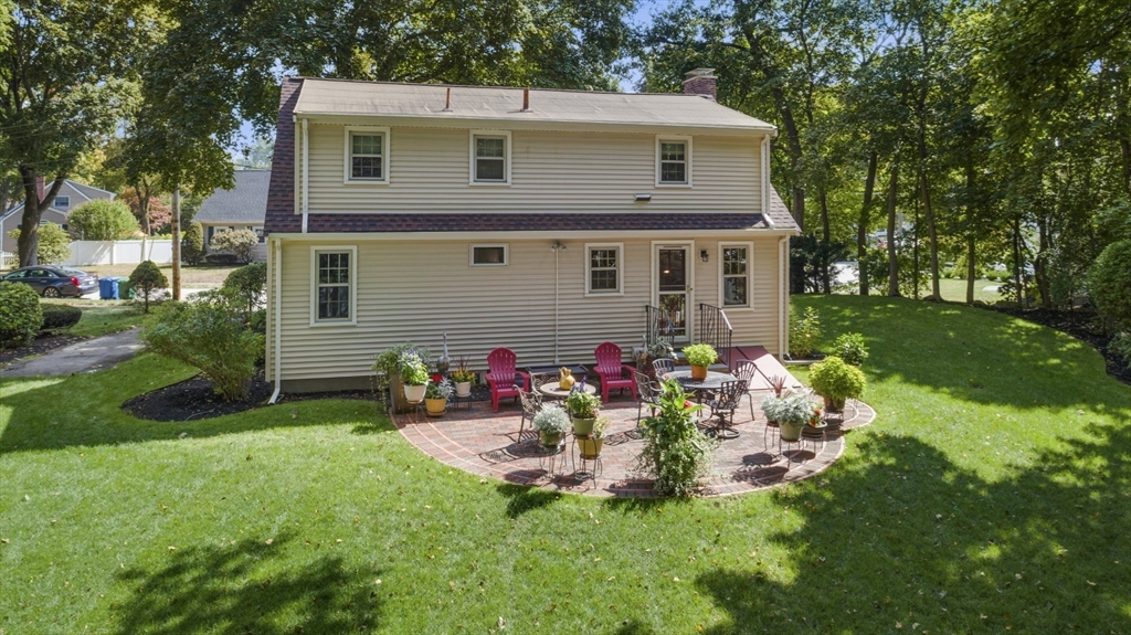 42 Sturges Road Reading, MA 01867 - Photo 37 of 42 a view of a house with a yard and garden