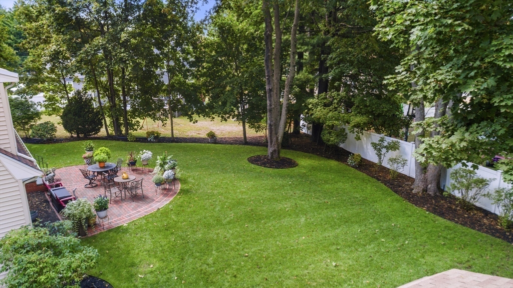 42 Sturges Road Reading, MA 01867 - Photo 39 of 42 a view of a table and chairs in the garden