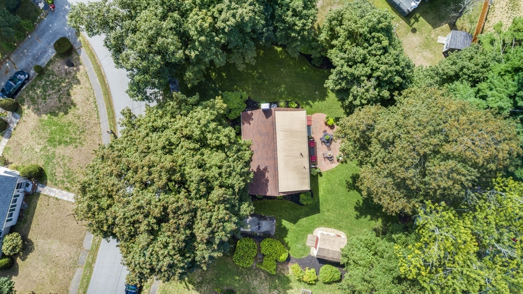 42 Sturges Road Reading, MA 01867 - Photo 40 of 42 an aerial view of a house with a yard and trees