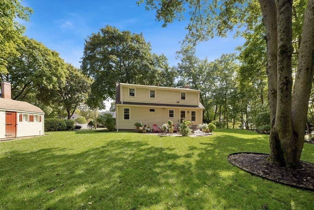 42 Sturges Road Reading, MA 01867 - Photo 5 of 42 a view of a house with a yard and sitting area